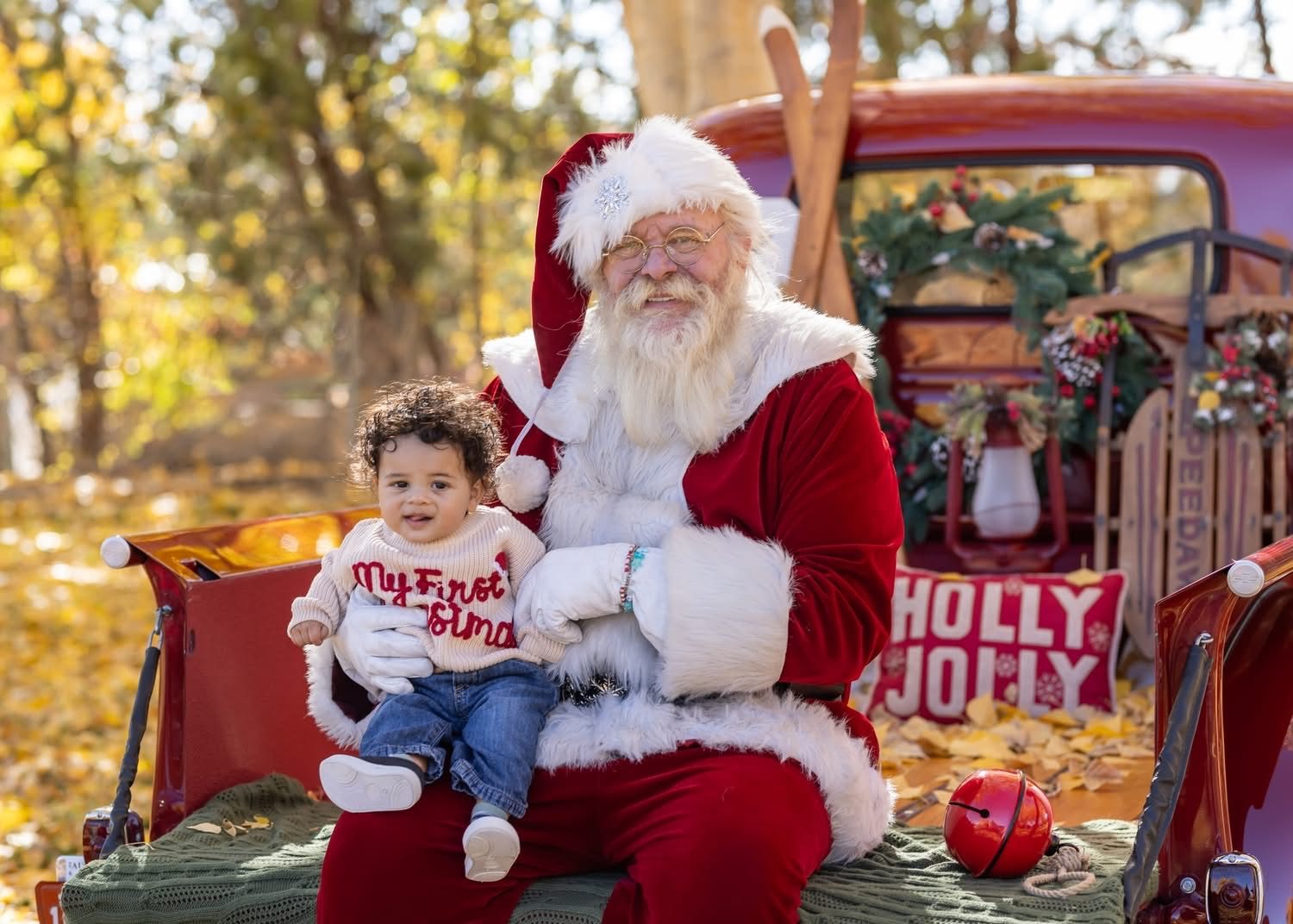 Santa Michael with a baby celebrating their first Christmas
