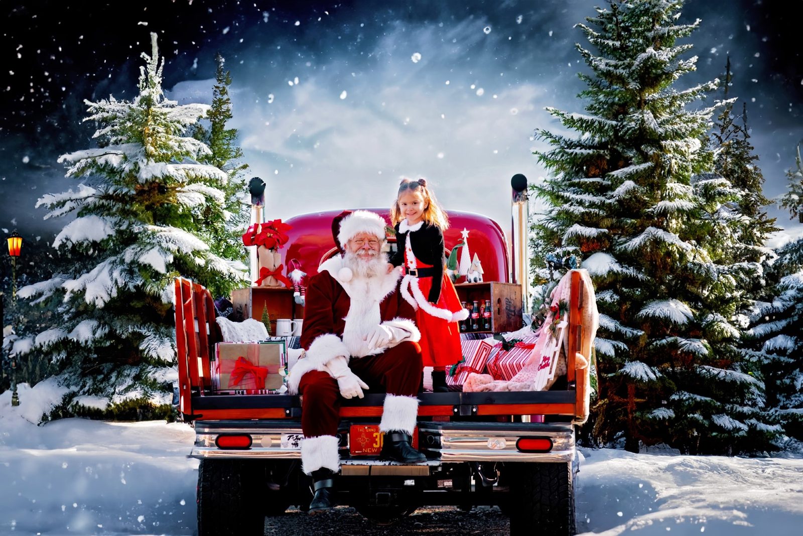 Santa Michael and a child on a red truck in the snow at night